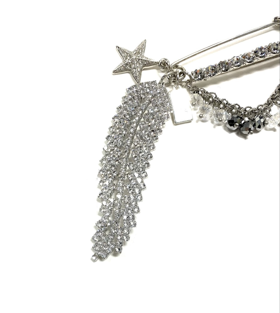 Rita Tesolin-Toronto-Brooch/Pin
Crystal pin, crystal feather, heart, star and cascades.  Artistic, exclusive, 
and handcrafted, this piece is a unique and collectable work of art. Crafted with the finest quality materials, it is made in Toronto.