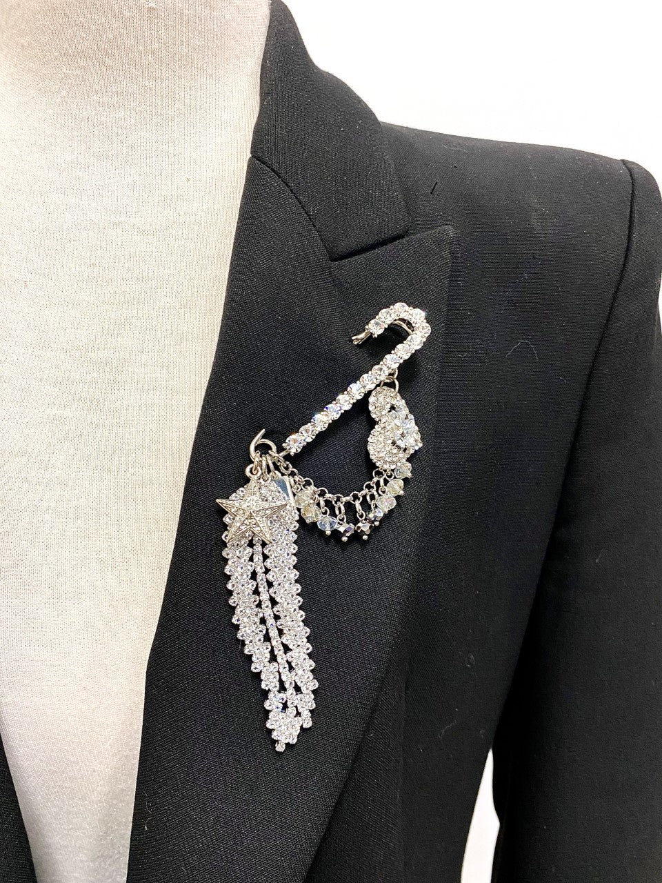 Rita Tesolin-Toronto-Glam Brooch
Crystal pin, crystal feather, heart, star and cascades.  Artistic, exclusive, and handcrafted, this piece is a unique and collectable work of art. Crafted with the finest quality materials, it is made in Toronto.
