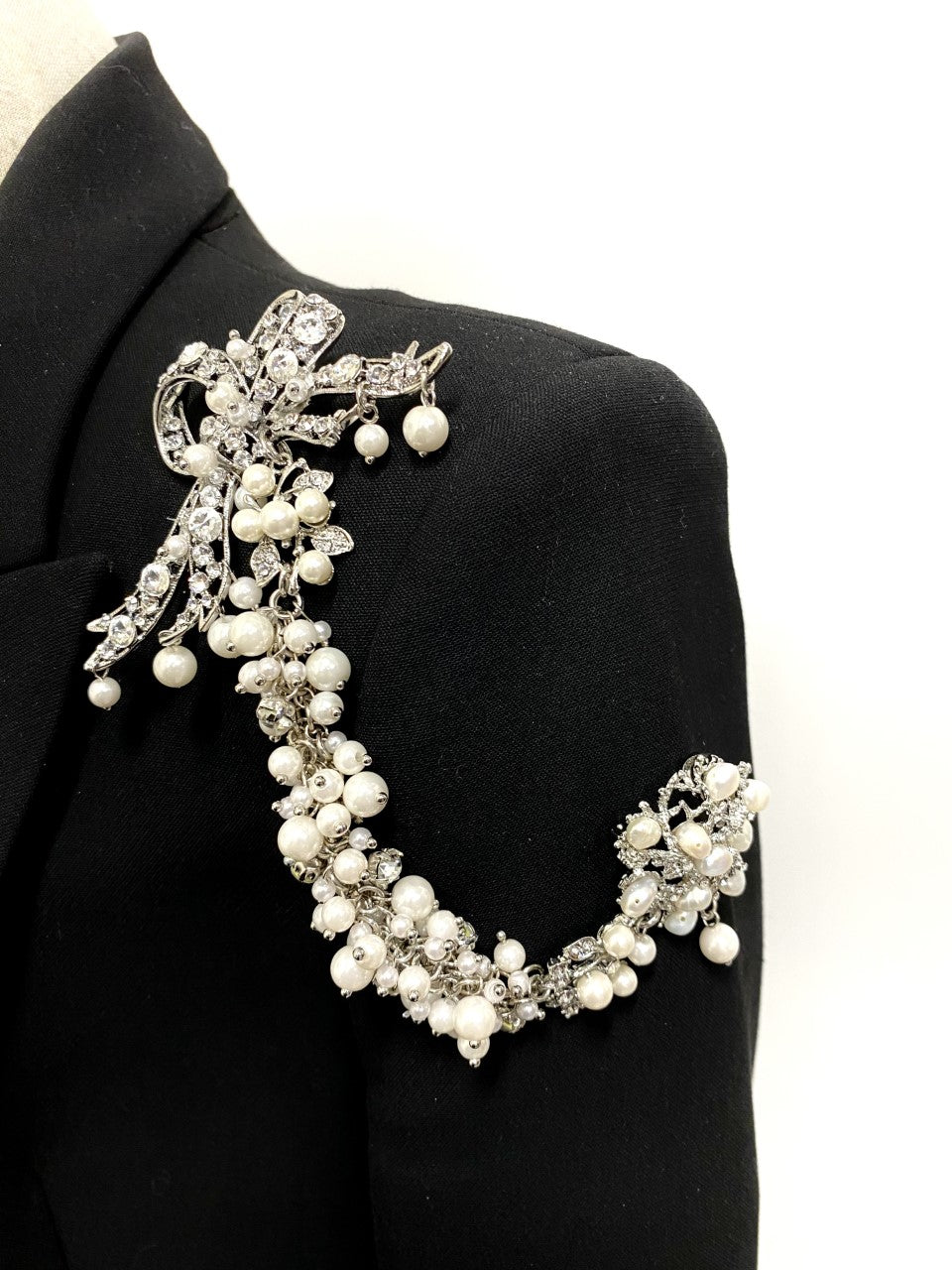 Artistic, exclusive, handcrafted, and one-of-a-kind. Collectable, finest quality, made in Toronto, Canada. Woman-owned and operated.  Crystal Bow, Austrian Crystal, Pearl, Brooch