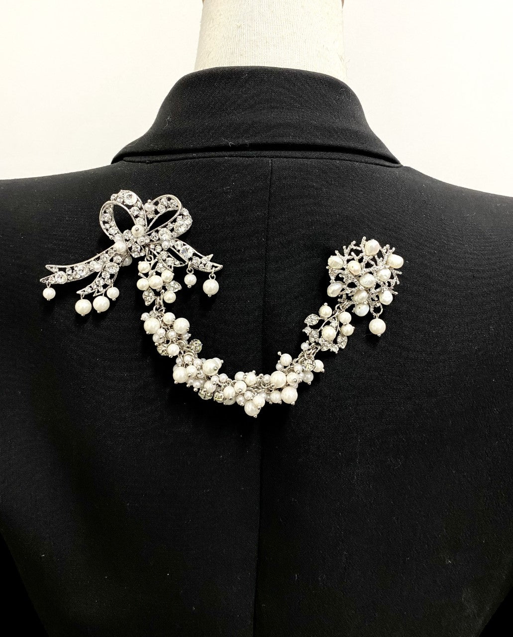 Artistic, exclusive, handcrafted, and one-of-a-kind. Collectable, finest quality, made in Toronto, Canada. Woman-owned and operated.  Crystal Bow, Austrian Crystal, Pearl, Brooch