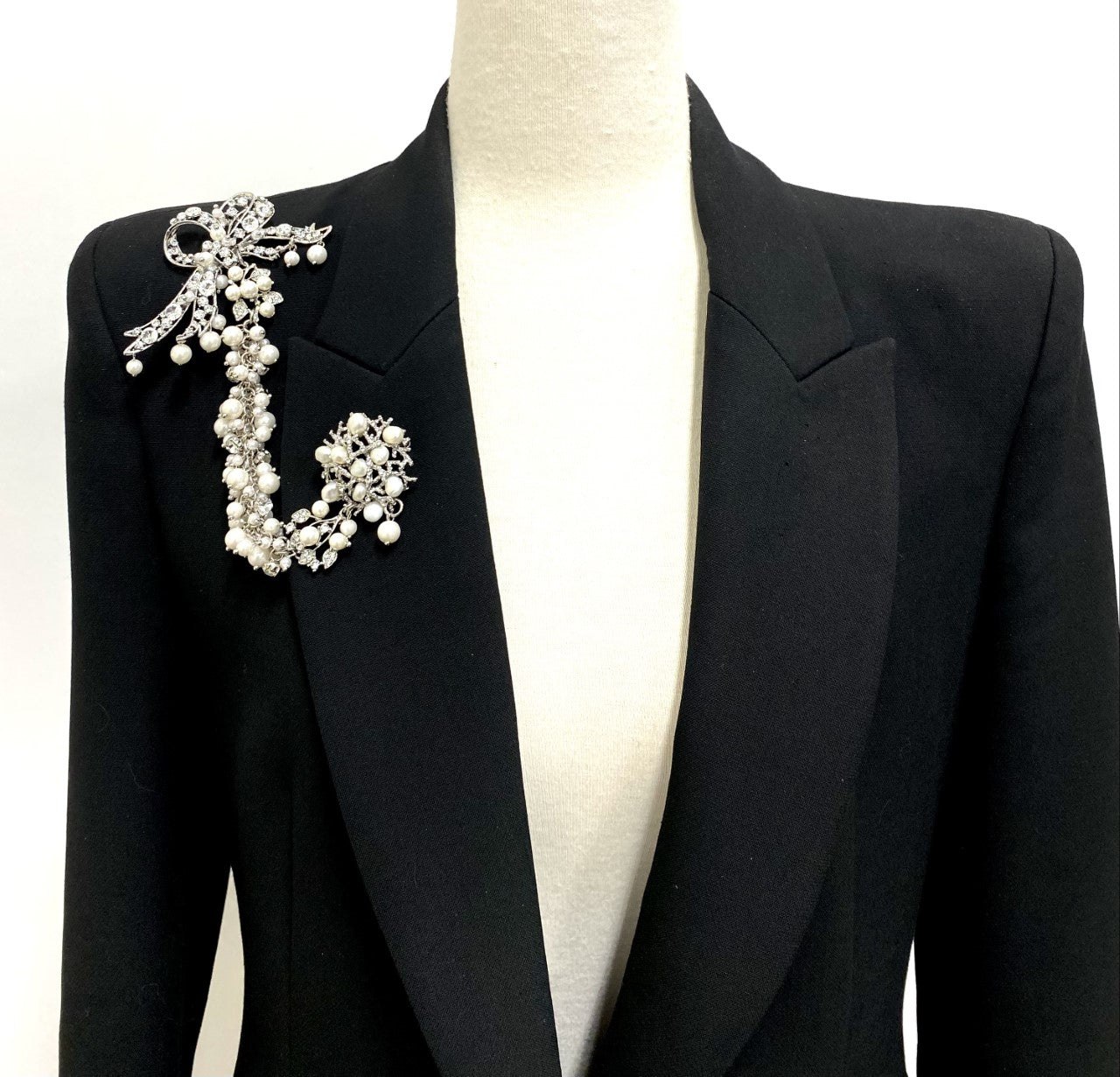 Artistic, exclusive, handcrafted, and one-of-a-kind. Collectable, finest quality, made in Toronto, Canada. Woman-owned and operated.  Crystal Bow, Austrian Crystal, Pearl, Brooch