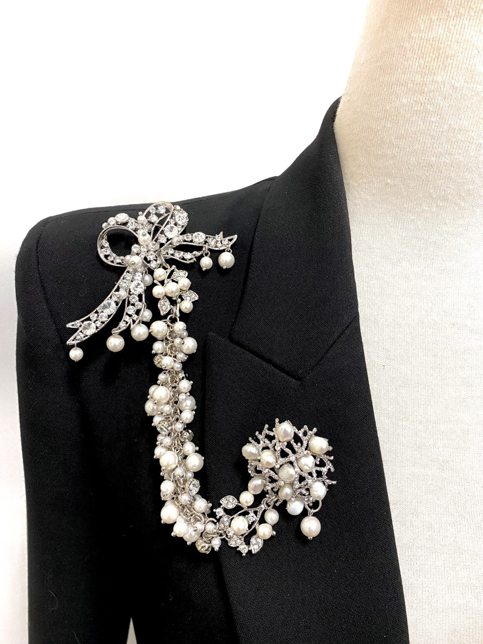Artistic, exclusive, handcrafted, and one-of-a-kind. Collectable, finest quality, made in Toronto, Canada. Woman-owned and operated.  Crystal Bow, Austrian Crystal, Pearl, Brooch