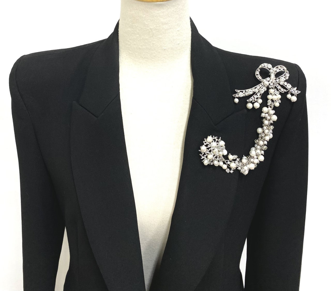 Artistic, exclusive, handcrafted, and one-of-a-kind. Collectable, finest quality, made in Toronto, Canada. Woman-owned and operated.  Crystal Bow, Austrian Crystal, Pearl, Brooch