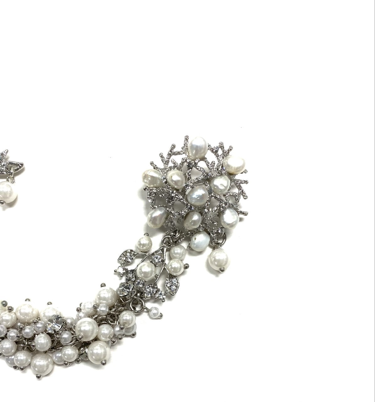 Artistic, exclusive, handcrafted, and one-of-a-kind. Collectable, finest quality, made in Toronto, Canada. Woman-owned and operated.  Crystal Bow, Austrian Crystal, Pearl, Brooch